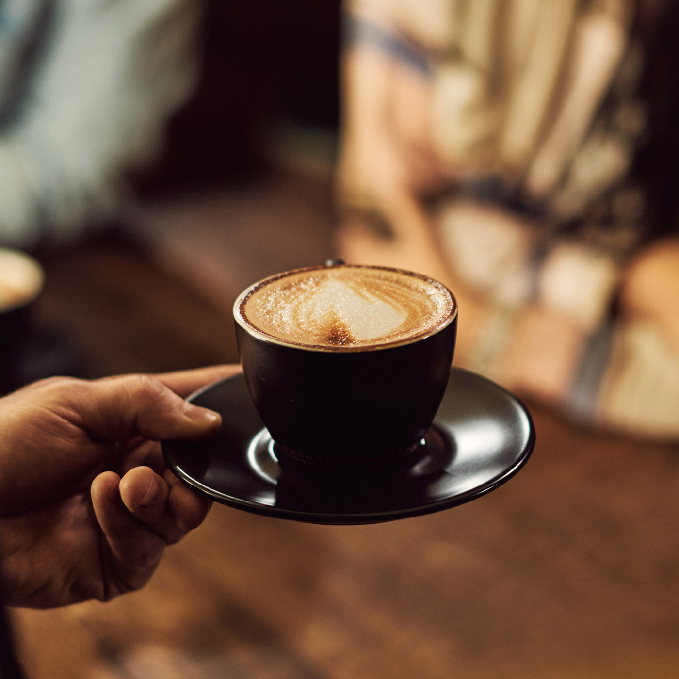 espresso machine brewing coffee into cup home barista setup