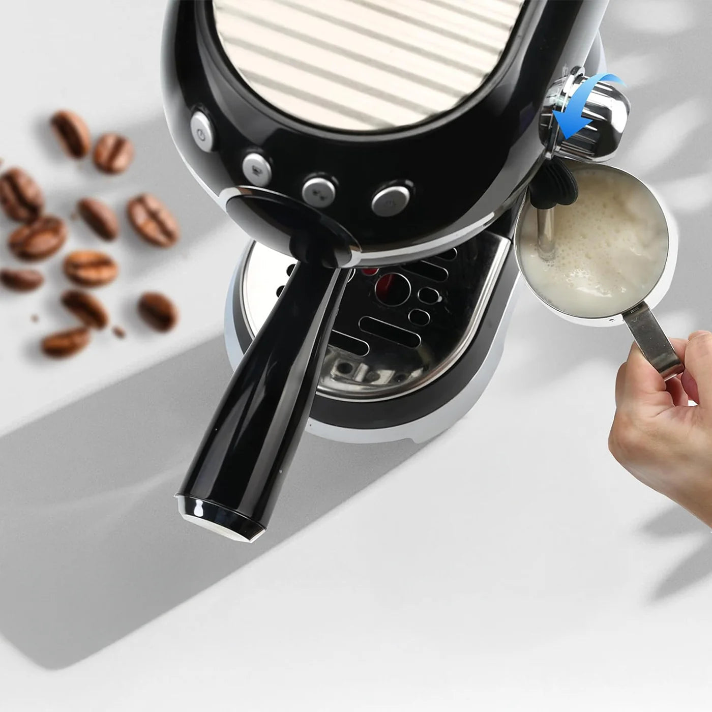Espresso machine with a hand holding a scoop of coffee grounds on a light background