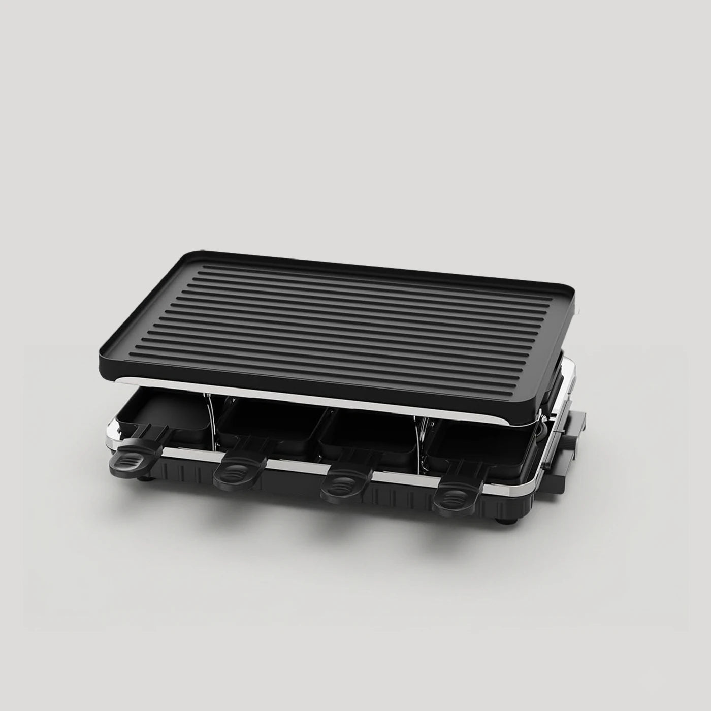 compact electric raclette grill angled view non stick griddle surface