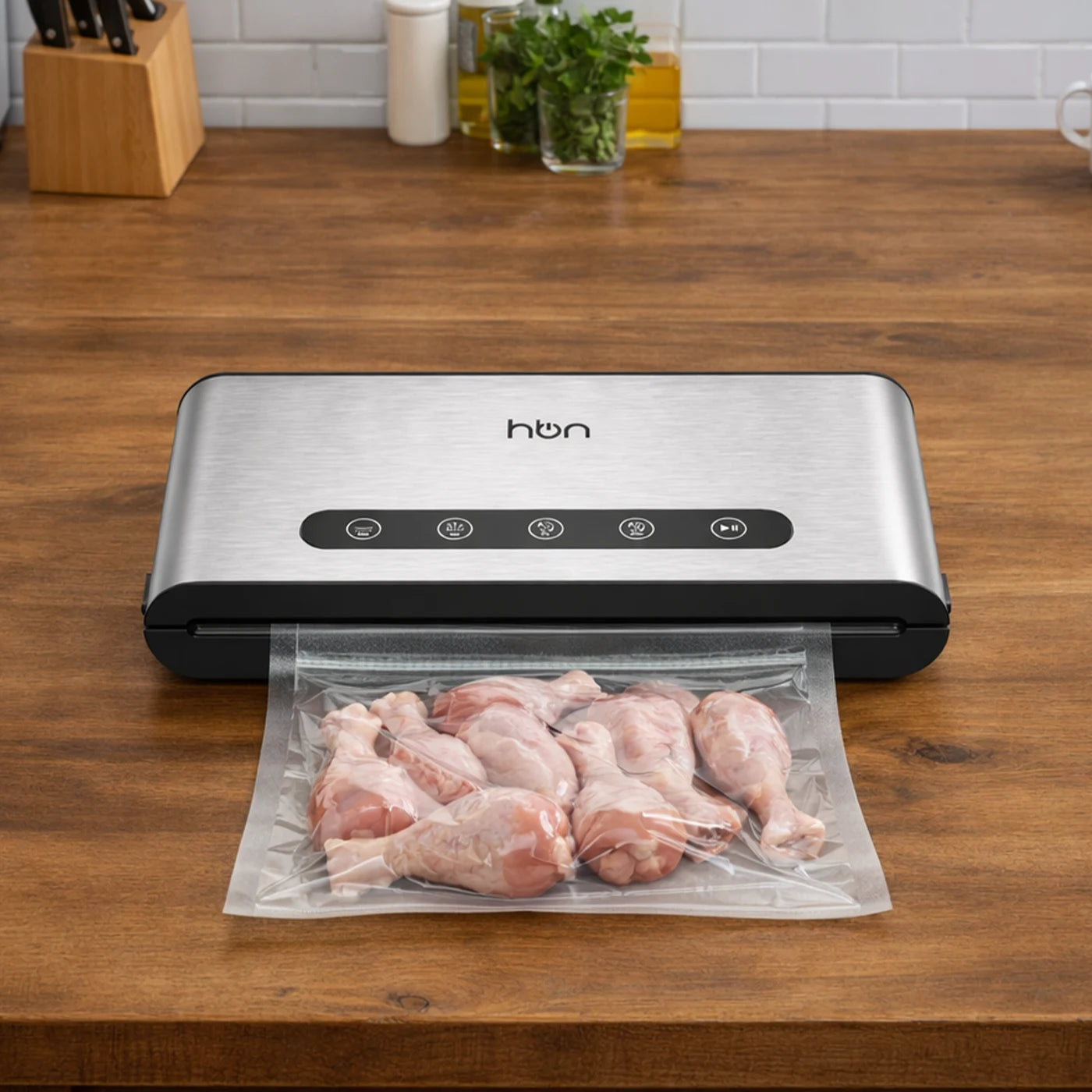 vacuum sealer sealing raw chicken for food preservation hands free operation
